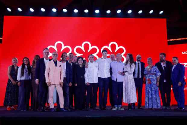 Michelin's new lineup of three-star California chefs onstage during the California Michelin awards ceremony at Eve on Wednesday, June 24, 2026 in San Diego, California. Fourth from left is San Diego's own William Bradley, chef-director of Addison by William Bradley in Carmel Valley. (Meg McLaughlin / The San Diego Union-Tribune)