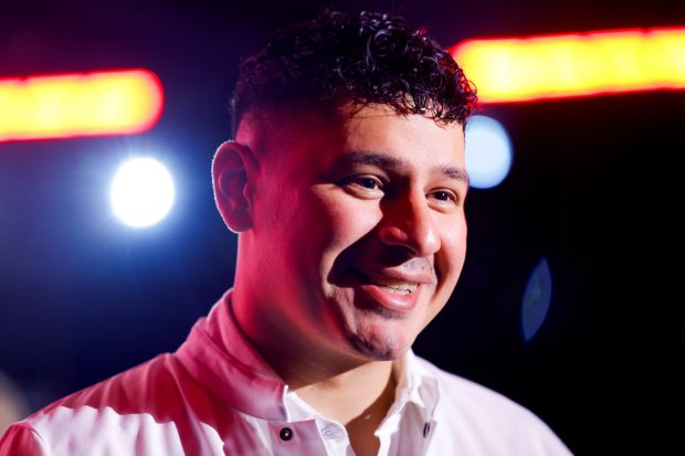 Elijah Arizmendi smiles as he receives his chef's coat during the California Michelin awards ceremony at Eve on Wednesday, June 24, 2026 in San Diego, California. Arizmendi was awarded a Michelin star earlier in the evening. (Meg McLaughlin / The San Diego Union-Tribune)