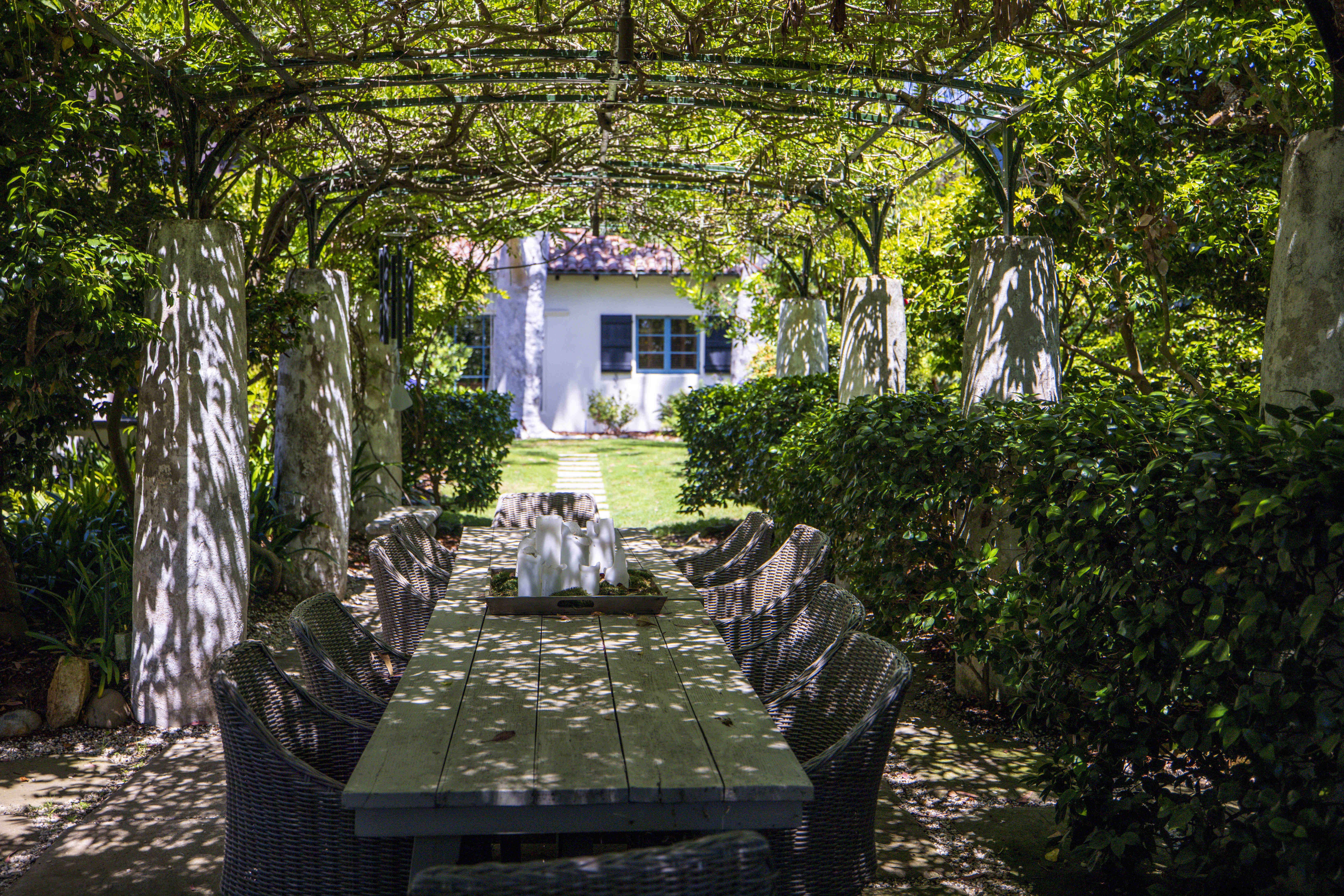 An outdoor dining table in the garden at 1205 Muirlands...