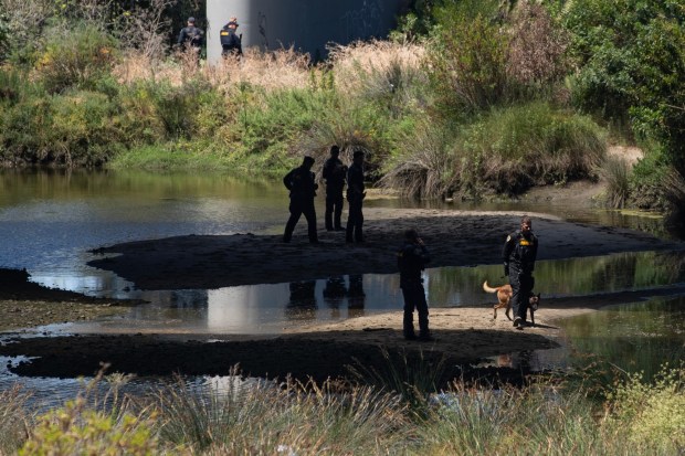 San Diego, CA - Law enforcement officers engage in a stand off with a suspect in the San Diego River Bed underneath Pacific Highway and Interstate 5 on Tuesday, June 30, 2026, in San Diego, CA. (Luke Johnson / The San Diego Union-Tribune)