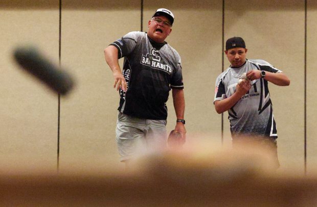 SAN DIEGO, CA - June 14, 2026: Jerry Lopez, a Ventura County Sheriff's deputy, reacts as he watches his beanbag land on the cornhole board as he and Ricardo Luna Ortiz, a California state corrections officer, compete in the cornhole singles competition during the United States Police and Fire Championships held at the Marriott Mission Valley in San Diego on Sunday, June 14, 2026. (Hayne Palmour IV / For The San Diego Union-Tribune)