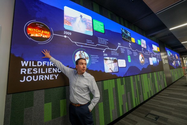 SDG&E's Vice President of Wildfire and Climate Science, Brian D'Agostino shows a San Diego County wildfire history timeline while in the Emergency Operations Center at SDG&E in San Diego on Tuesday, Nov. 12, 2024. (Hayne Palmour IV / For The San Diego Union-Tribune)