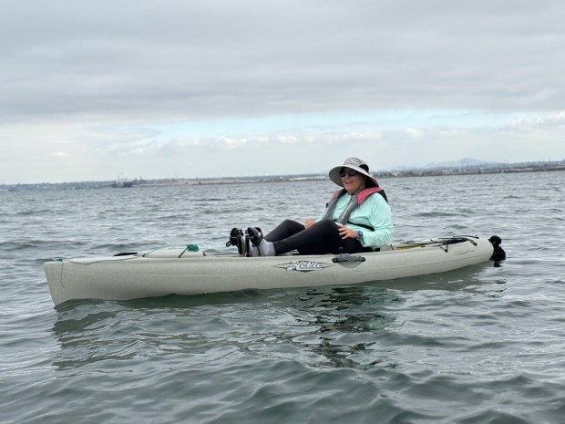 Tracy Tempest, a community scientist who monitors green sea turtles, kayaking in the San Diego Bay. (Photo by S. Madrak)