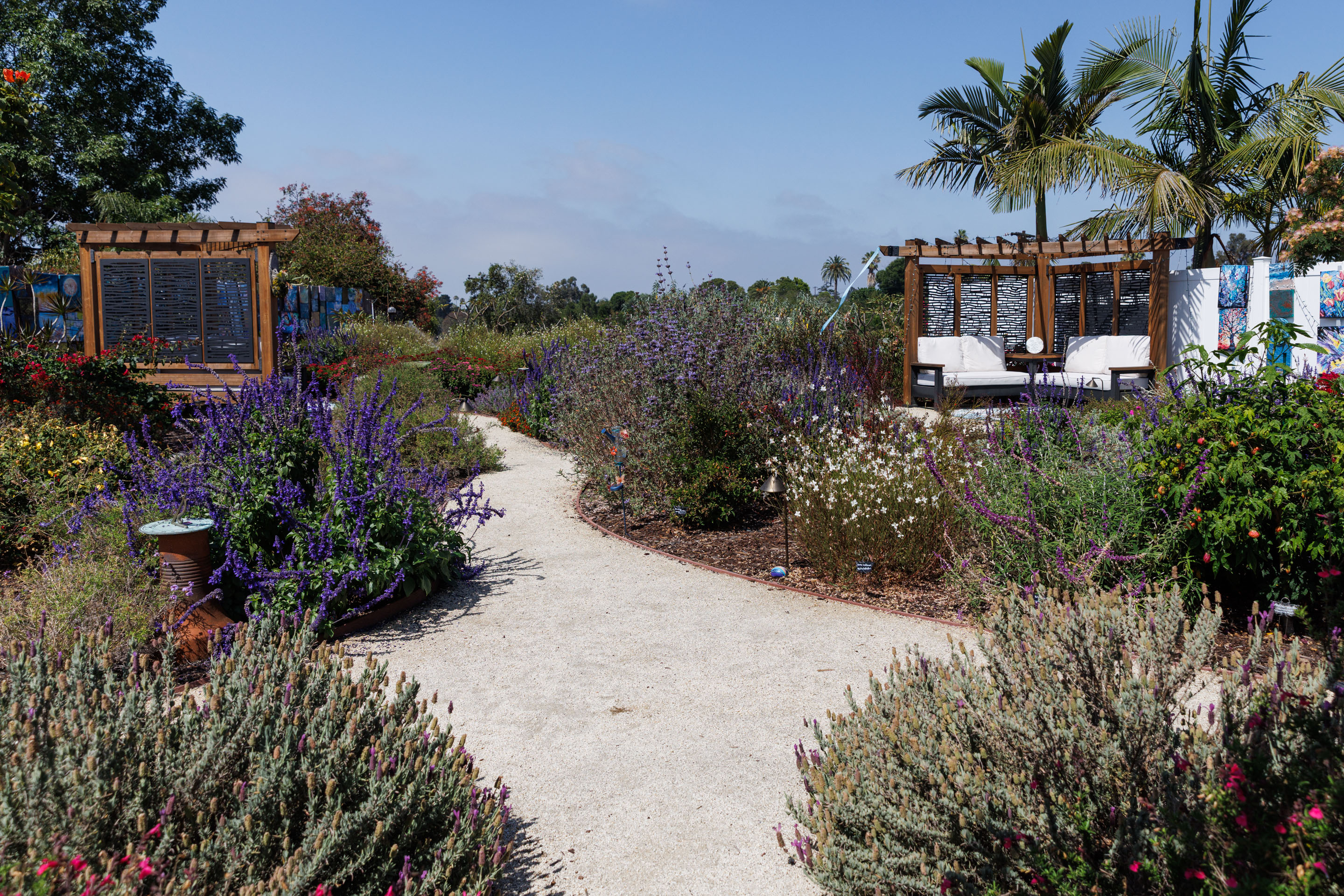 A view of the backyard shows two cabanas, one that...