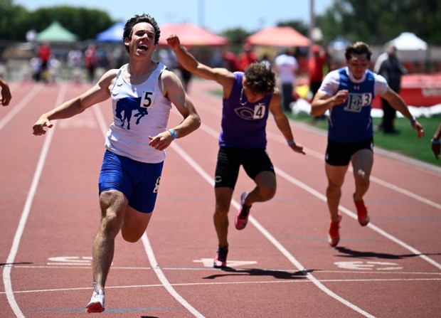 Rancho Bernardo's Brice Abawi, left, celebrates as he win the boys 100M at the CIF San Diego Section track meet May 23, 2026 in San Diego, Calif. (Photo by Denis Poroy)