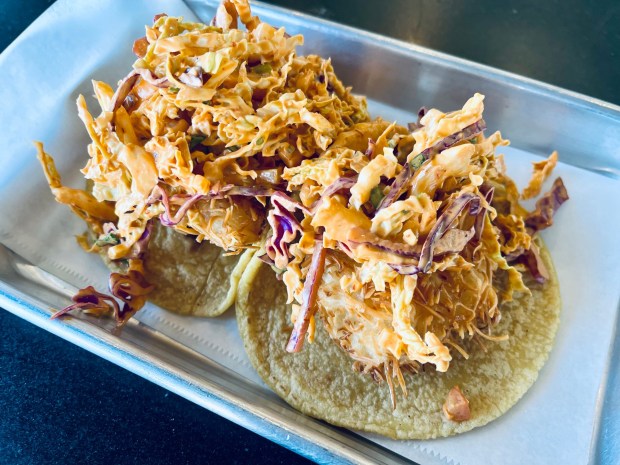 Fish Guts' De Coco is a coconut-battered Baja California-style shrimp taco with Mexican coleslaw, pico de gallo and chipotle aioli. (Carlos Rico / The San Diego Union-Tribune)