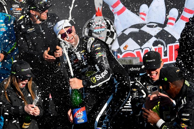 Shane Van Gisbergen, center, celebates with his team after winning a NASCAR Cup Series auto race Sunday, May 10, 2026, in Watkins Glen, N.Y. (Photo/Adrian Kraus)