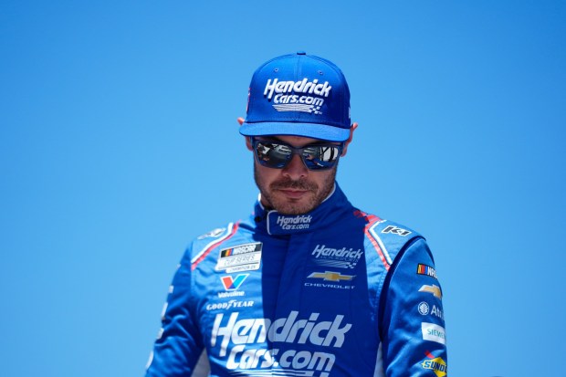 Kyle Larson walks to his car before a NASCAR Cup Series auto race at Michigan International Speedway in Brooklyn, Mich., Sunday, June 7, 2026. (AP Photo/Paul Sancya)