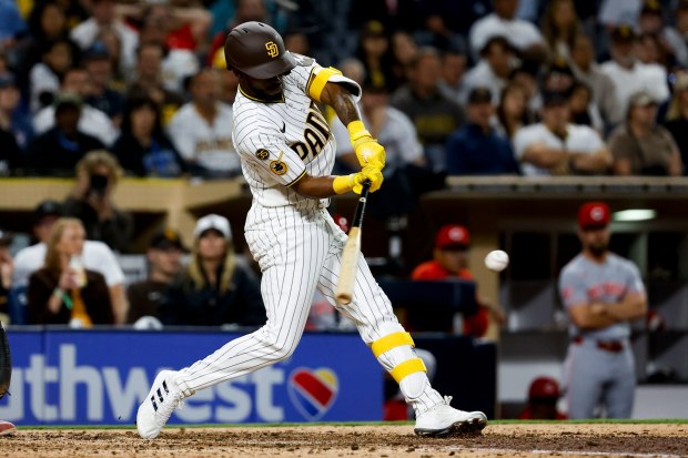 Samad Taylor #0 of the San Diego Padres hits a single against the Cincinnati Reds during the eighth inning at Petco Park on Monday, June 8, 2026 in San Diego, California. (Meg McLaughlin / The San Diego Union-Tribune)