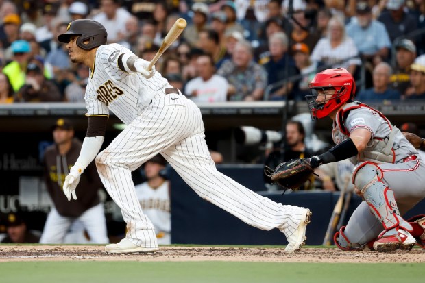 Manny Machado #13 of the San Diego Padres singles against the Cincinnati Reds during the third inning at Petco Park on Tuesday, June 9, 2026 in San Diego, California. (Meg McLaughlin / The San Diego Union-Tribune)