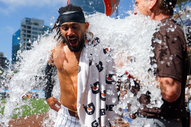 Fernando Tatis Jr. #23 of the San Diego Padres is doused after walk-off home run against the Cincinnati Reds during the ninth inning at Petco Park on Wednesday, June 10, 2026 in San Diego, California. (Meg McLaughlin / The San Diego Union-Tribune)
