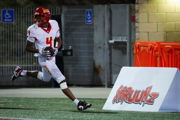 Cathedral Catholic's Isaac Cook scores a touchdown against Carlsbad during the CIF San Diego Section Open Division finals at Southwestern College on Tuesday, Nov. 25, 2025 in San Diego, California. (Meg McLaughlin / The San Diego Union-Tribune)