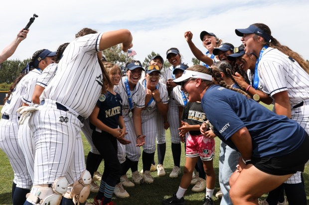 Mater Dei Catholic's softball team celebrate their CIF Division 1 Southern California Regional final victory against La Habra High at Mater Dei Catholic High School on Saturday, June 6, 2026. The Crusaders defeated the Highlanders 3-0. (Kristian Carreon / The San Diego Union-Tribune)