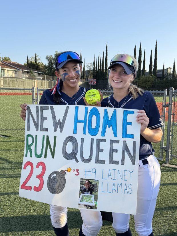 Del Norte High School's Lainey Llamas, left, celebrates with teammate and longtime friend Alexis "Lulu" Kyles after setting her school's home run record. (Lainey Llamas)