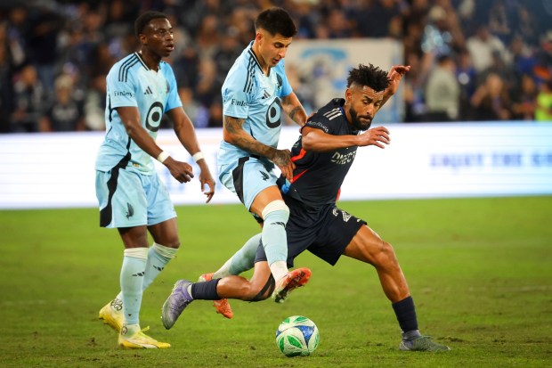 Joaquin Pereyra #26 of Minnesota United and Anibal Godoy #20 of San Diego FC battle for control of the ball during the 2025 MLS Cup Playoffs: Conference Semifinals at Snapdragon Stadium on Monday, Nov. 24, 2025 in San Diego, California. (Meg McLaughlin / The San Diego Union-Tribune)