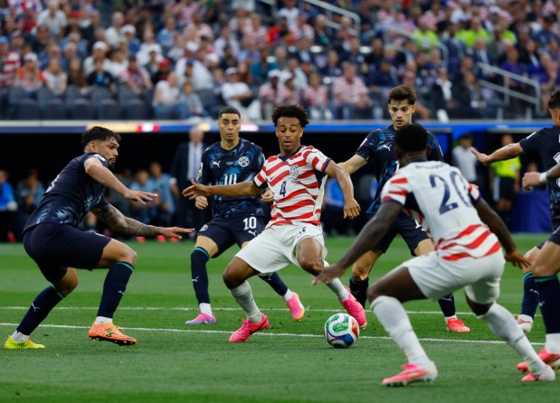 Tyler Adams #4 of the United States assists Folarin Balogun #20, who scored against Paraguay during a FIFA World Cup 2026 Group D match at Los Angeles Stadium on June 12, 2026 in Inglewood, California. (K.C. Alfred / The San Diego Union-Tribune)