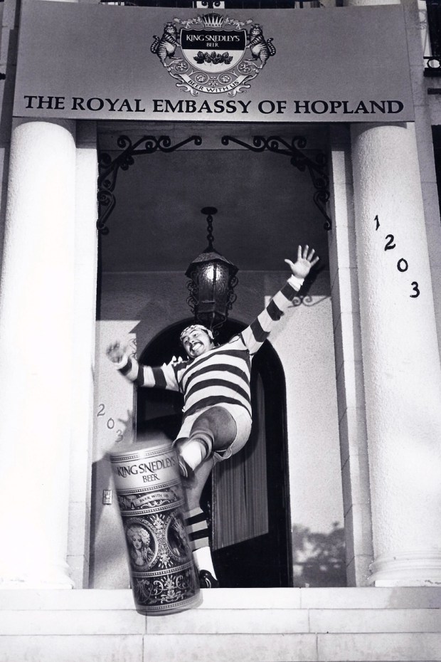 A member of the San Diego State rugby team plays kick the can with a large King Snedley's. (Chuck Buck collection)