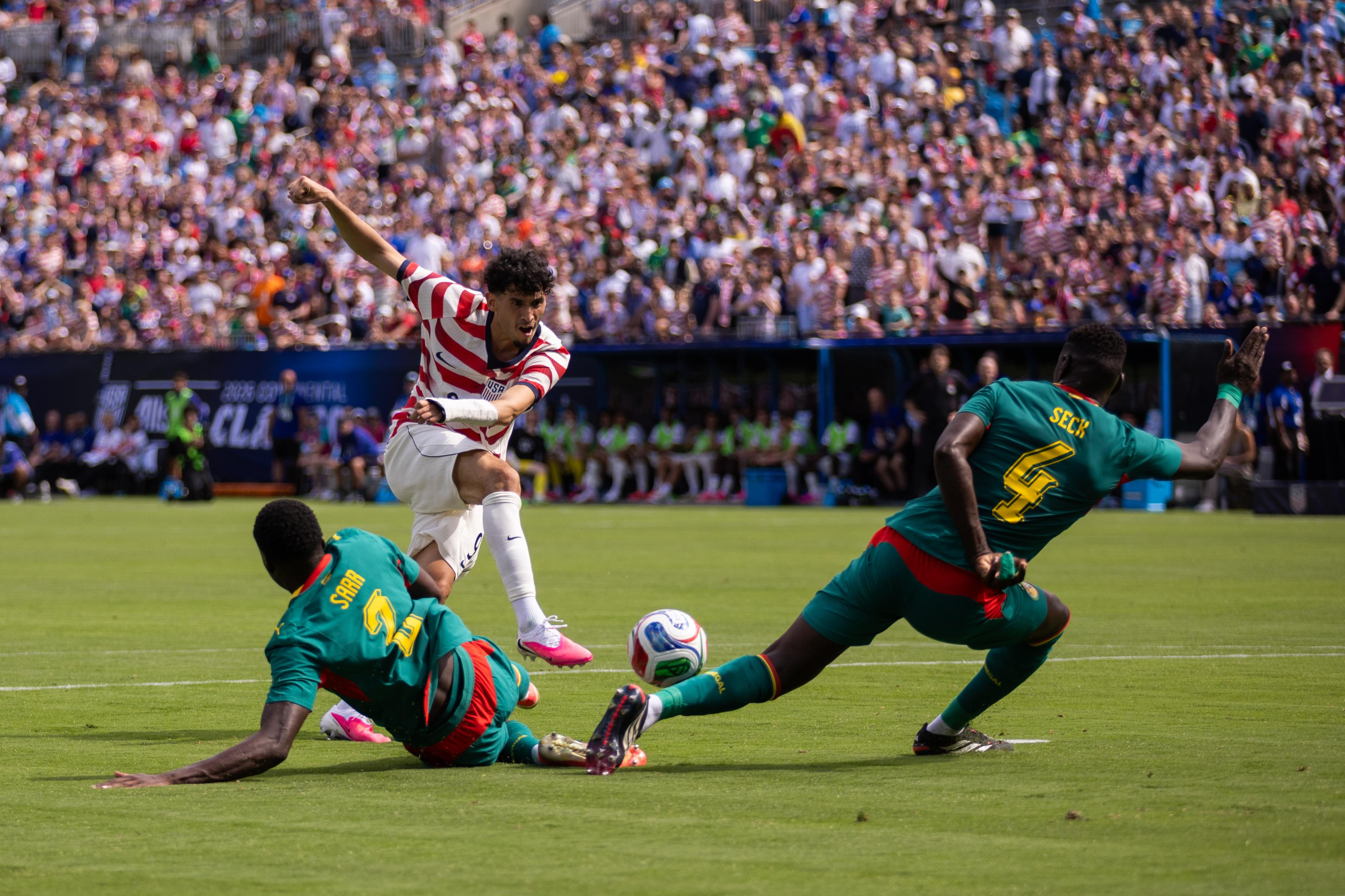 United States forward Ricardo Pepi, top left, has a shot...