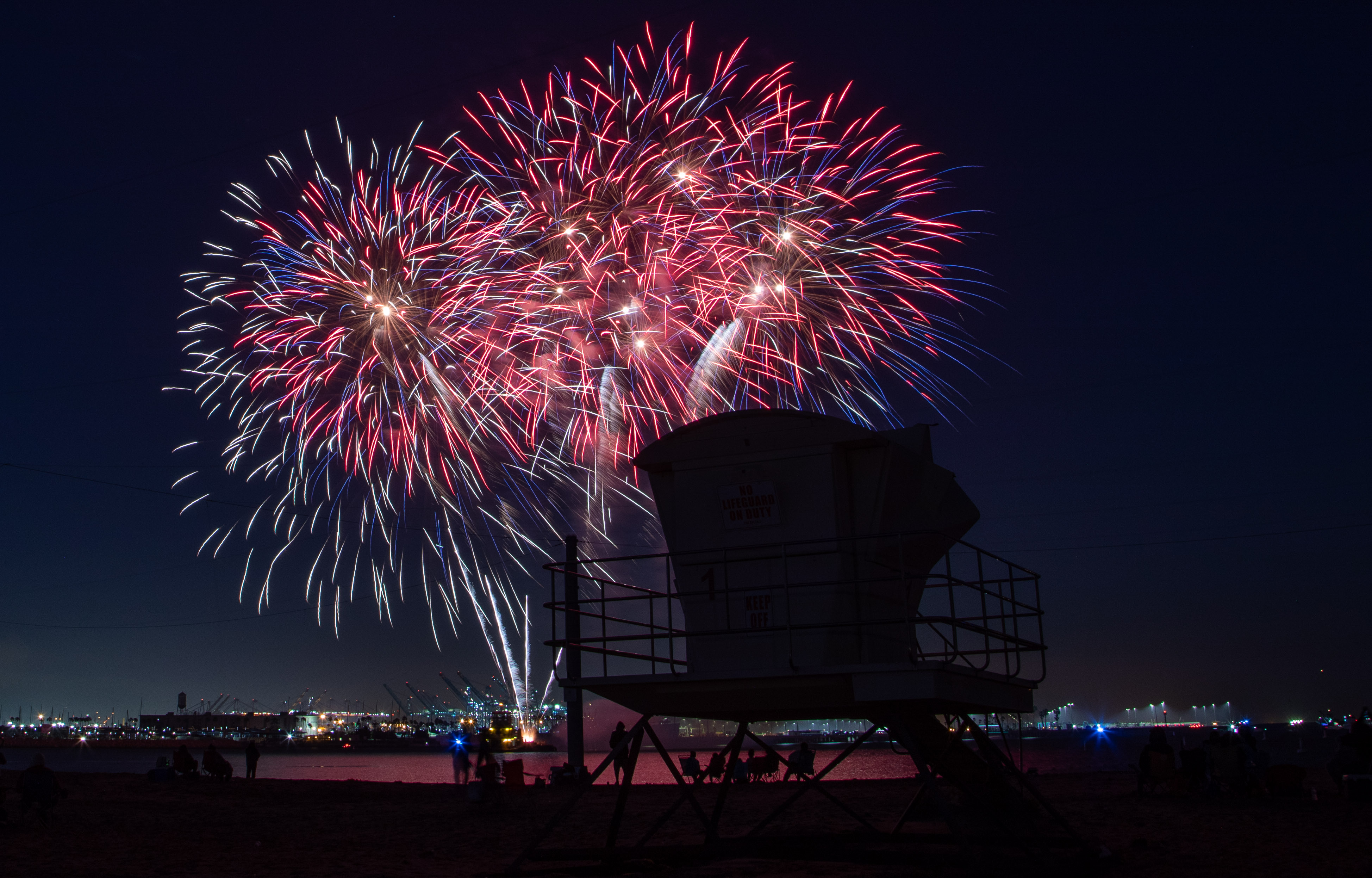Fireworks were shot off a barge in the harbor at...