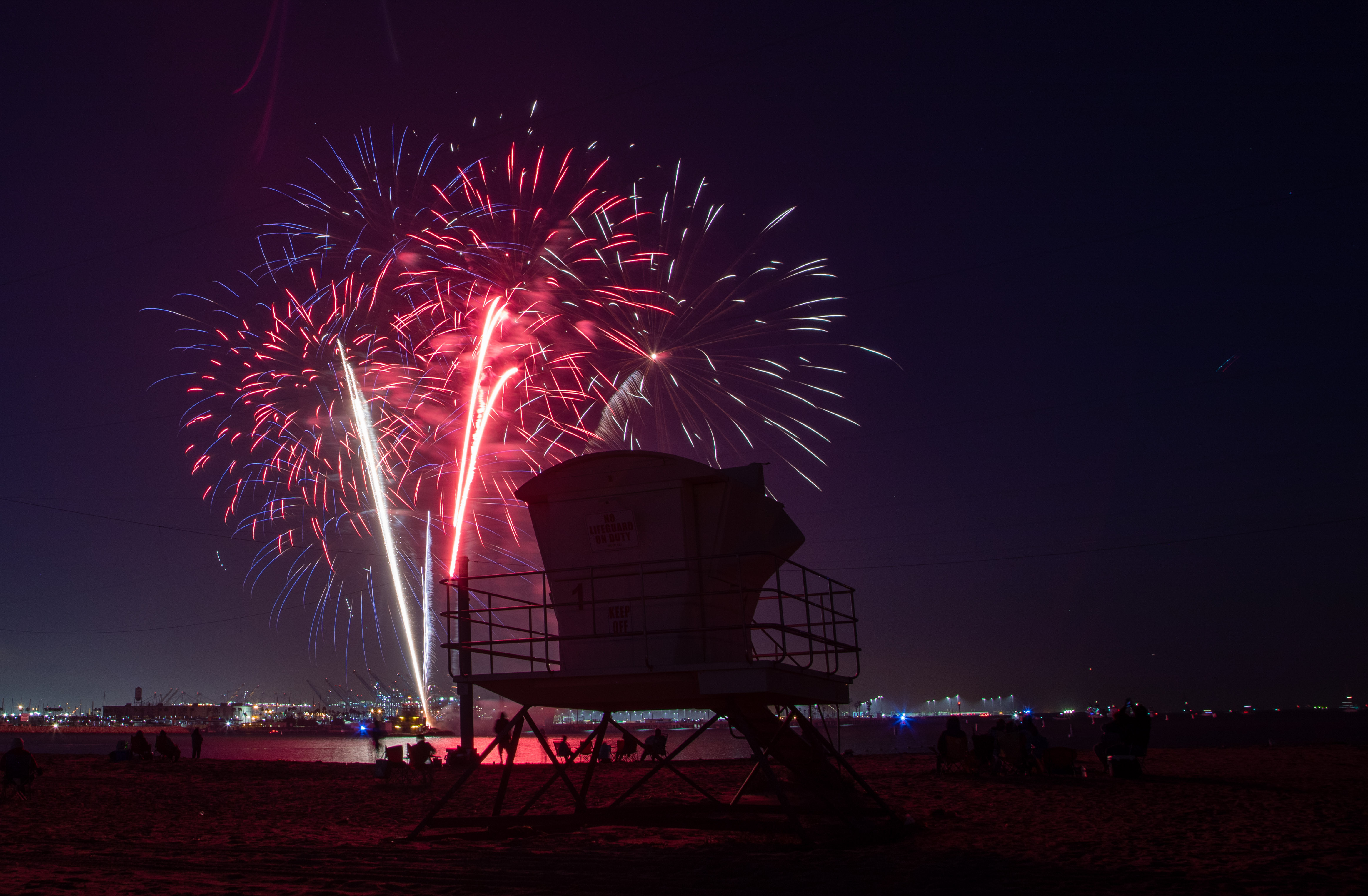 Fireworks were shot off a barge in the harbor at...