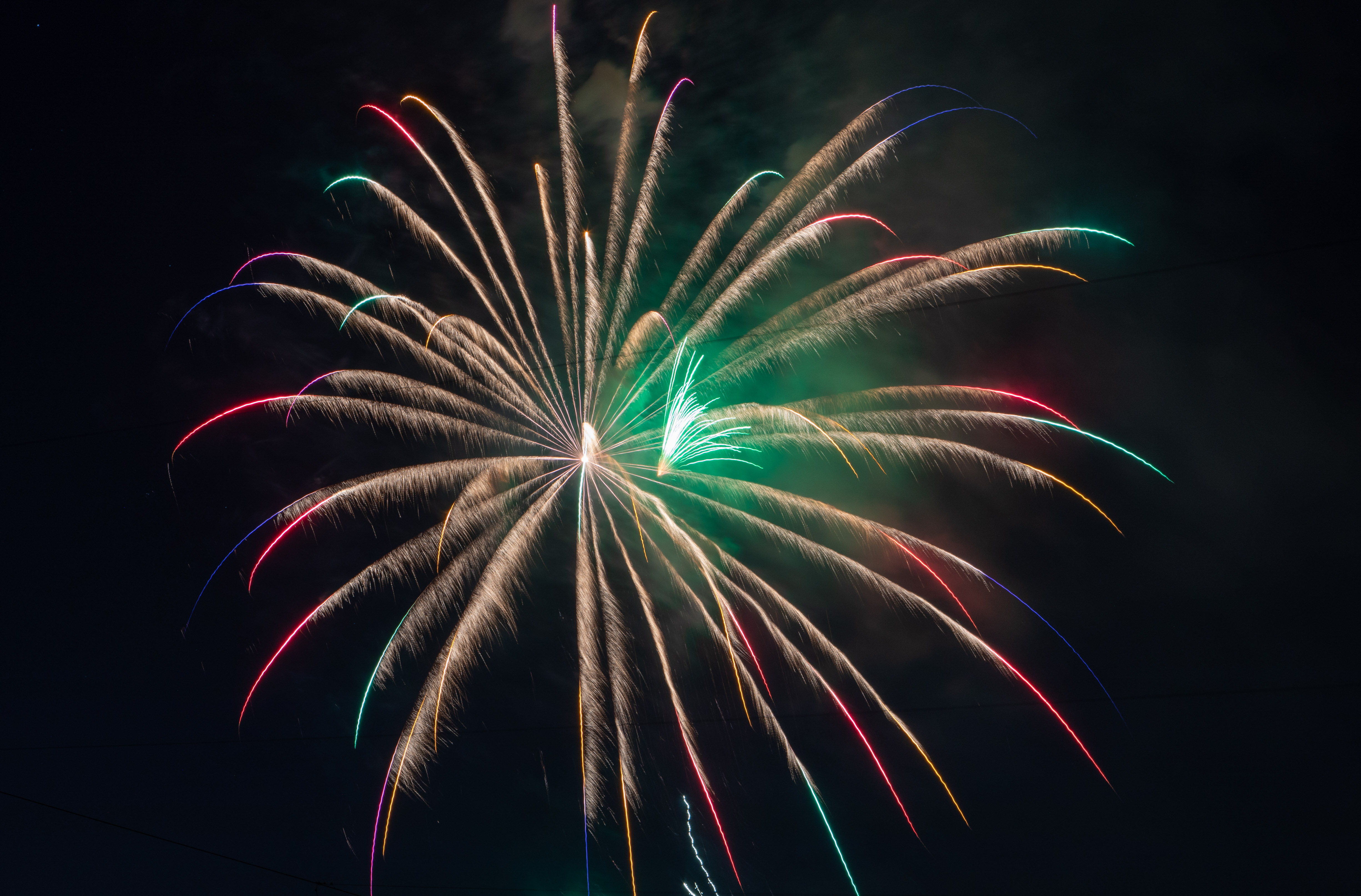 Fireworks were shot off a barge in the harbor at...