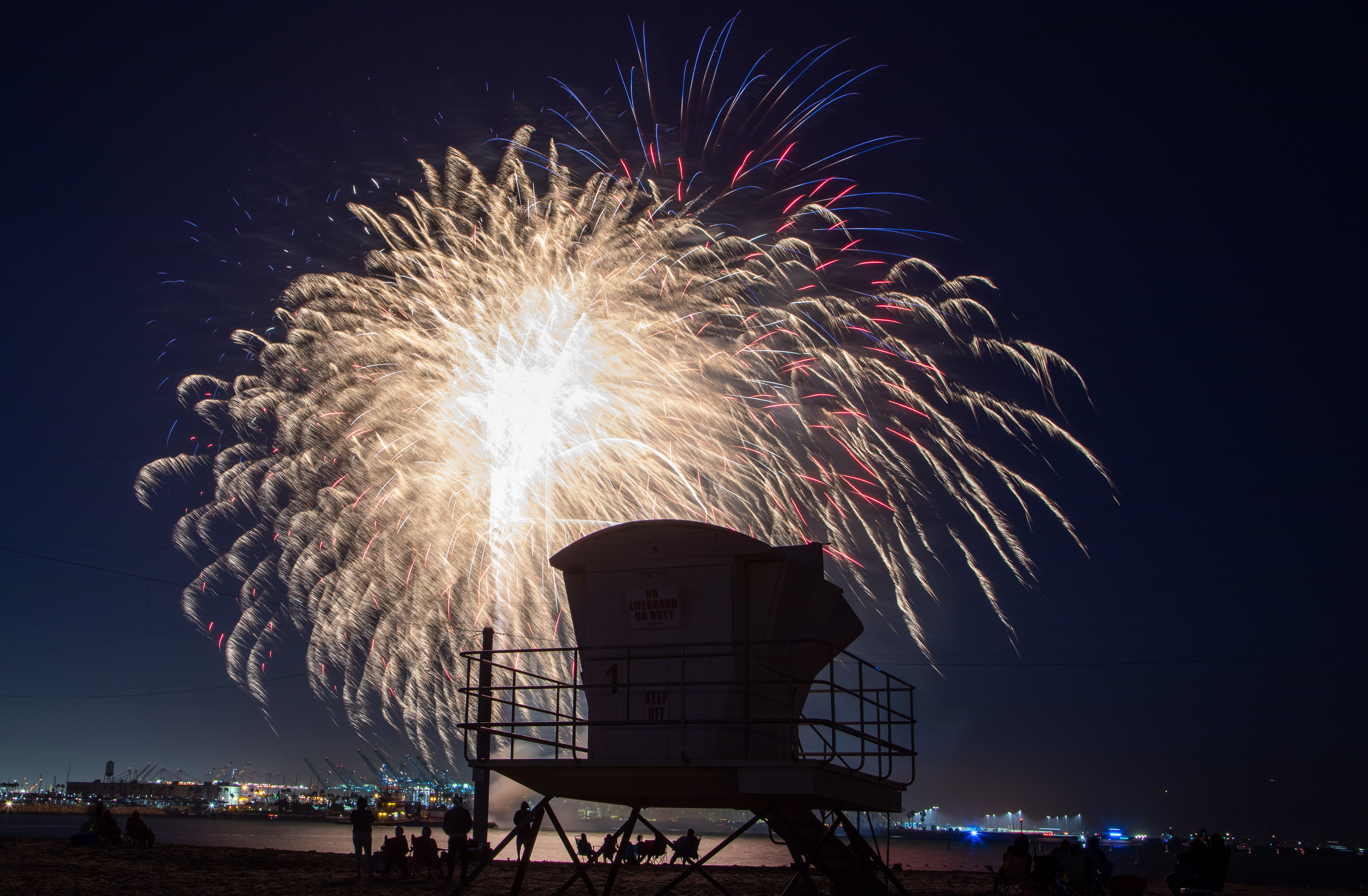 Fireworks were shot off a barge in the harbor at...