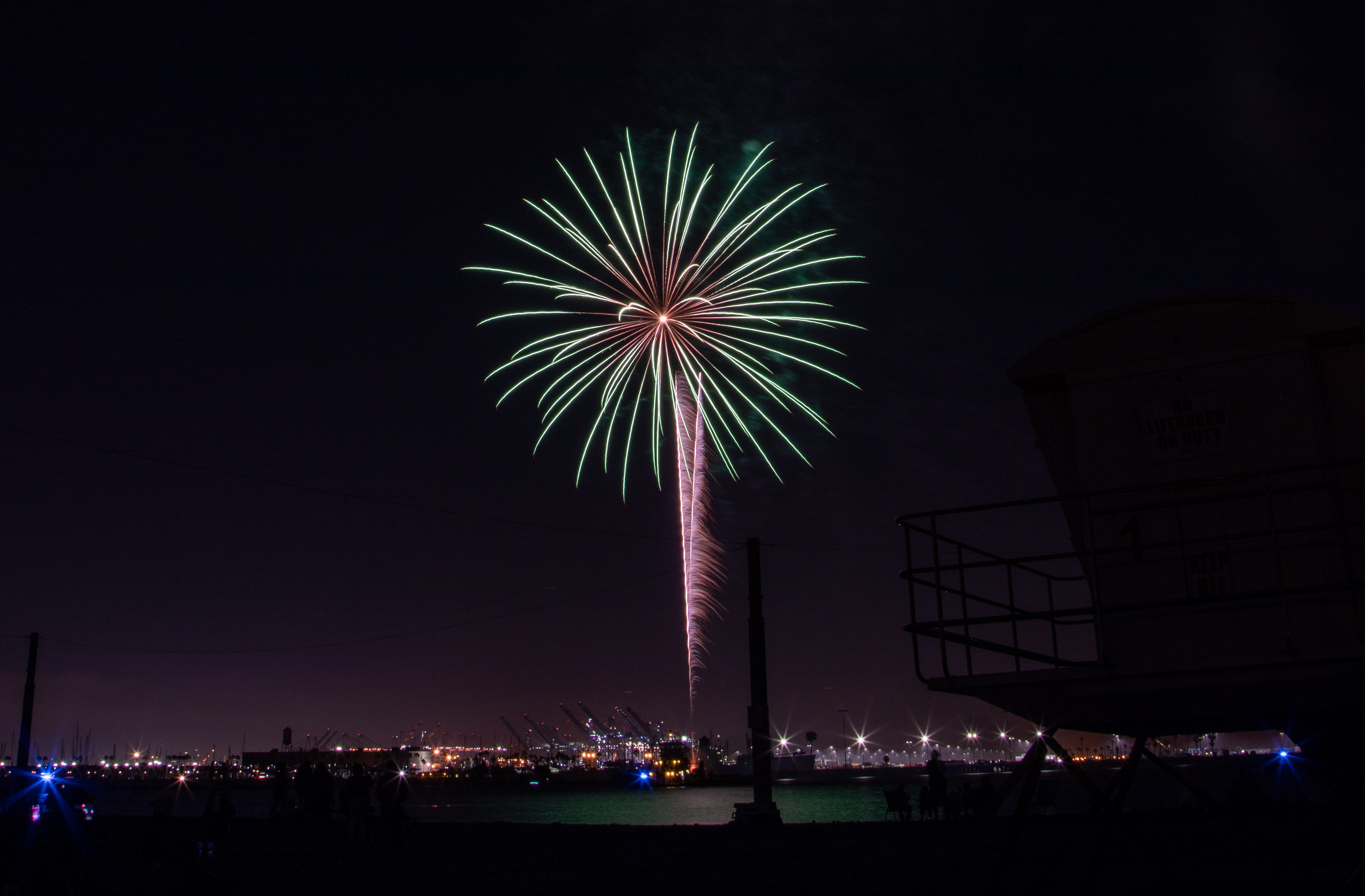 Fireworks were shot off a barge in the harbor at...
