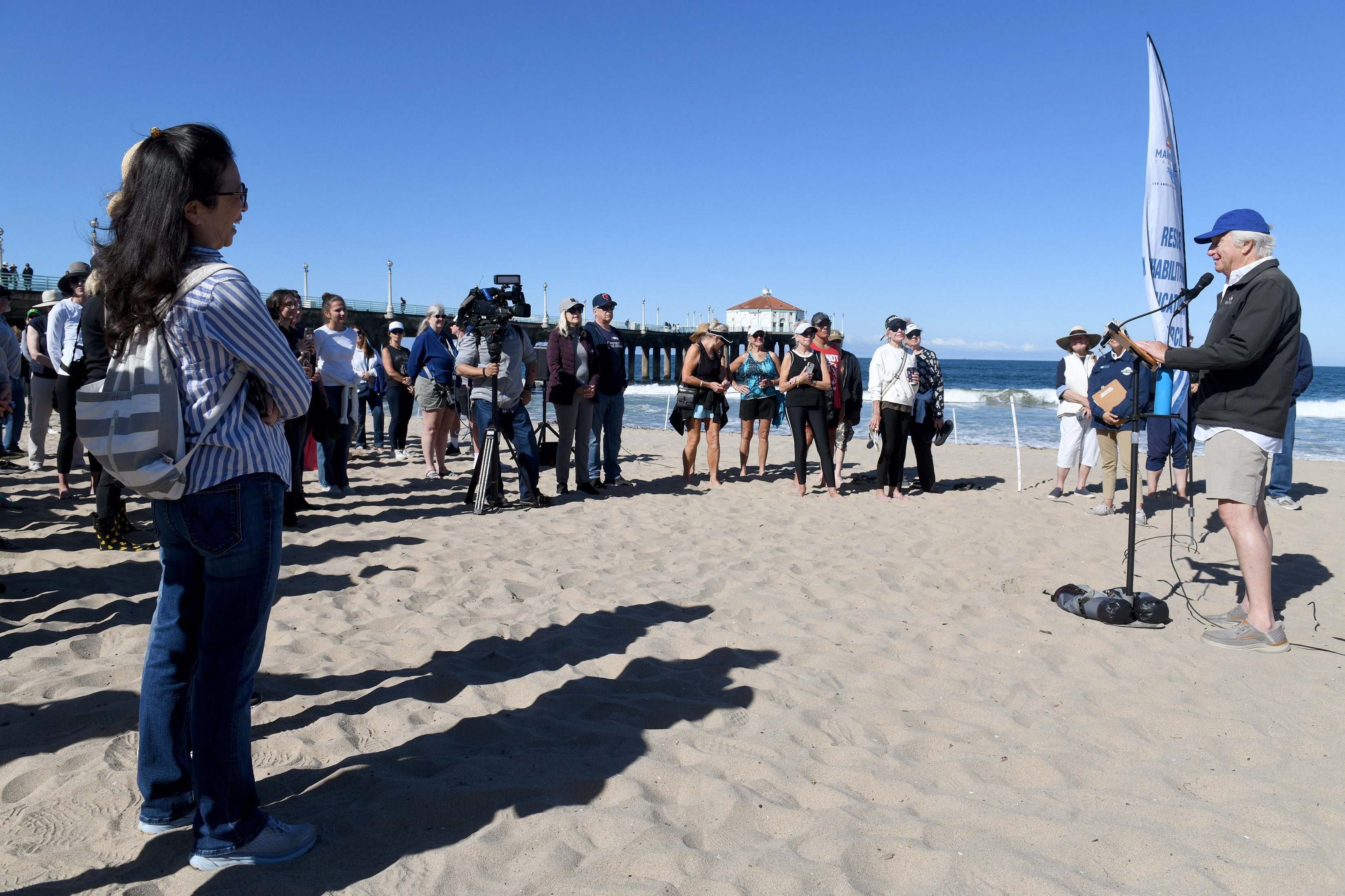 Mayor Joe Franklin joins volunteers with the Marine Mammal Care...