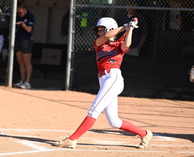 Representing the Macomb Area Conference, Hailee Lane (14) of Macomb L'Anse Creuse North watches her triple sail towards the outfield during Tuesday's MAC-OAA All-Star Softball Game at Oakland University on June 23, 2026. (DAN STICKRADT -- MediaNews Group)