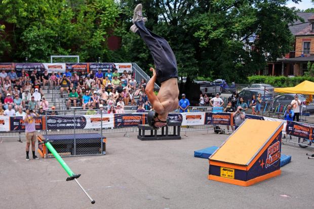 Extreme pogo athlete Connor Poe, 18, does a back-flip dismount during the Big Air competition during Pogopalooza 2026 in Wilkinsburg, Pa., Sunday, June 14, 2026. (AP Photo/Gene J. Puskar)