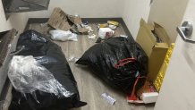 Tenants say piles of trash throughout the building are a common problem.