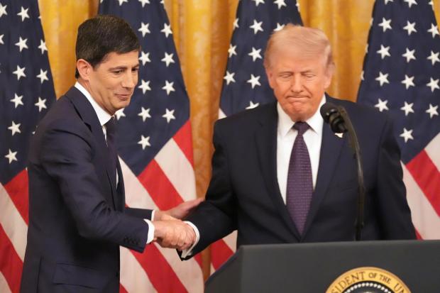 President Donald Trump shakes the hand of Federal Reserve Chairman Kevin Warsh.