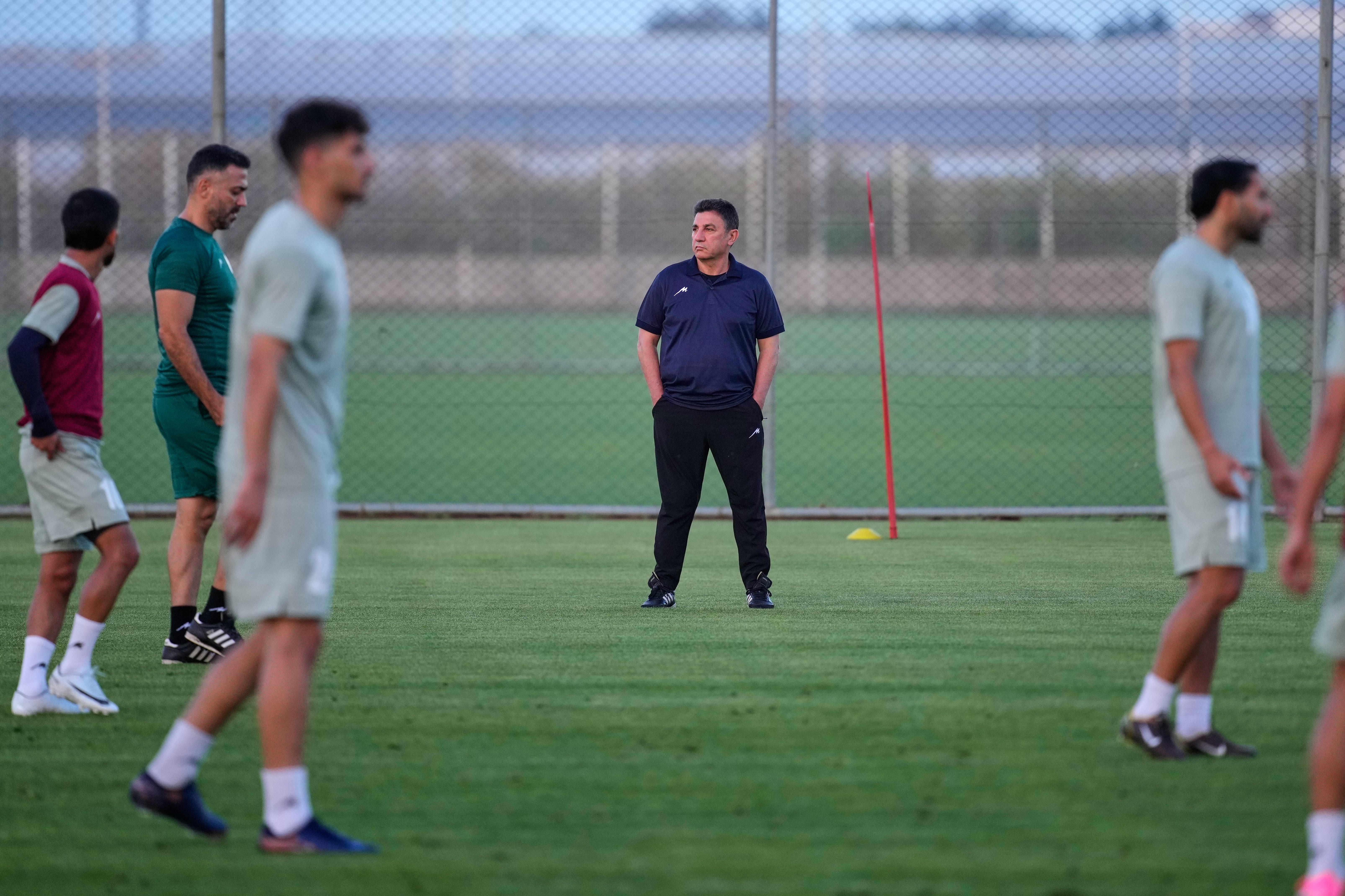 Iran’s head coach Amir Ghalenoei attends a training session, in...