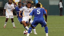 Jul 21, 2007; Carson, CA, USA; Los Angeles Galaxy midfielder Cobi Jones (13) is defended by Chelsea-FC midfielder Michael Essien (5) in the first half during their exhibition match at the Home Depot Center. Mandatory Credit: Gary A. Vasquez-USA TODAY Sports