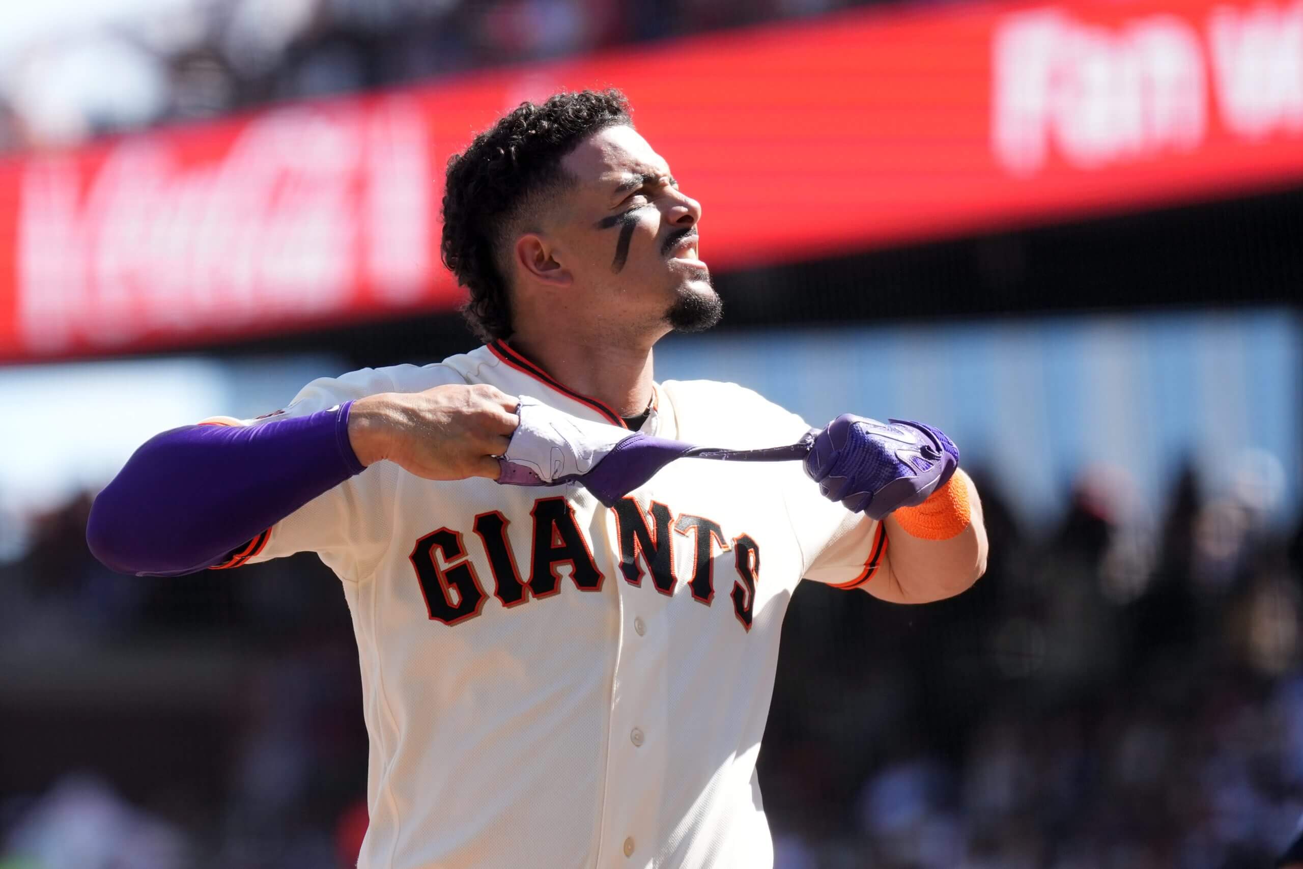 San Francisco Giants shortstop Willy Adames removes his batting glove after striking out against the New York Yankees during the fifth inning at Oracle Park.