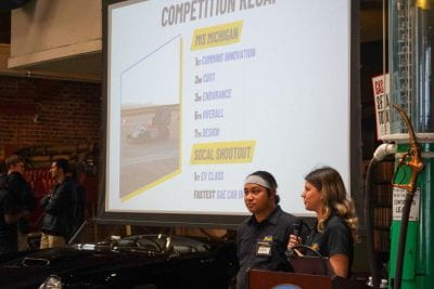 Robine van Venn speaking at Unveiling about Formula’s competition recap alongside a Baja team representative. Photo courtesy of Robine van Veen.