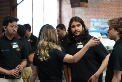 Robine van Veen directing some team members as they set up for SR-16’s Unveiling. Photo courtesy of Robine van Veen.