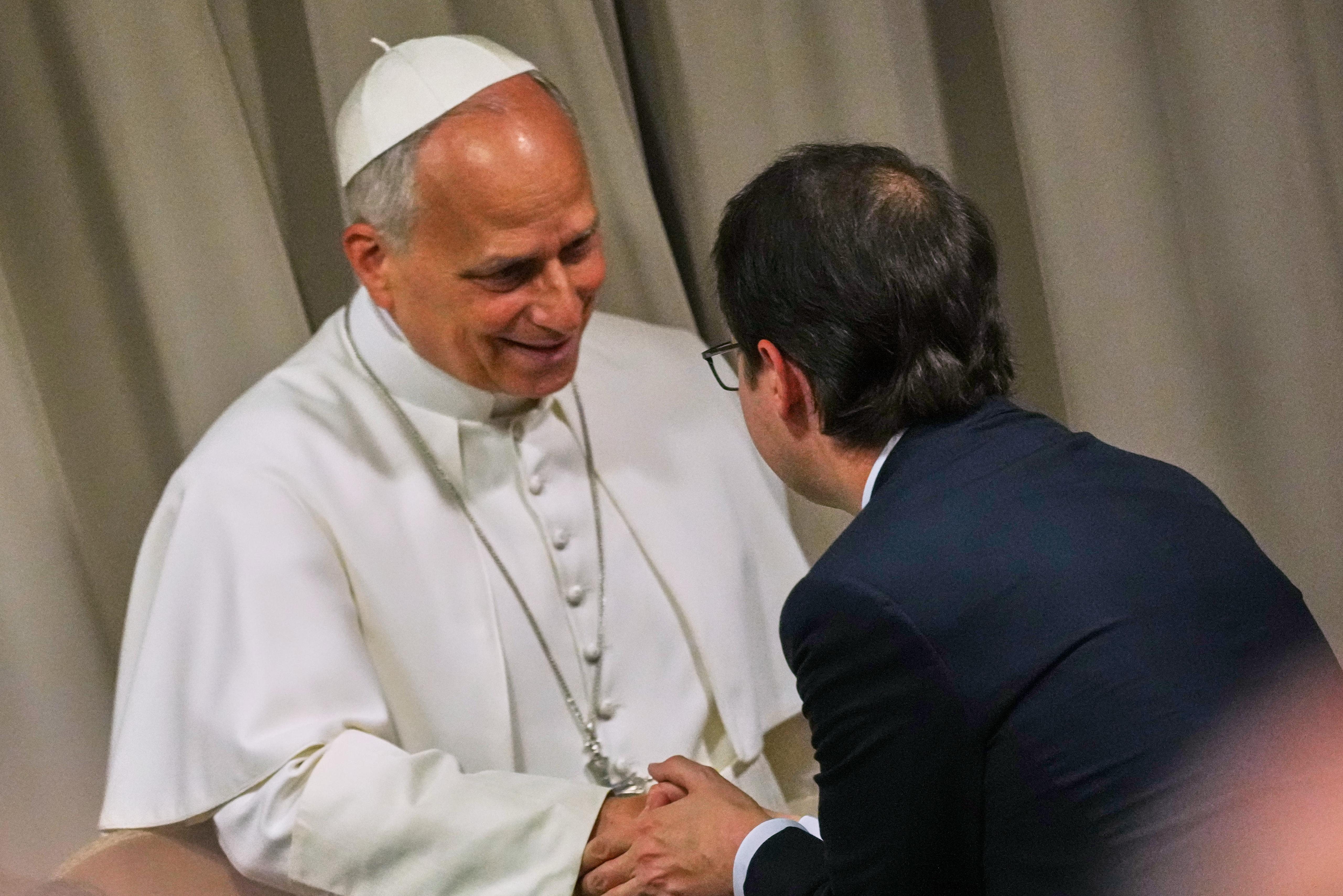 Pope Leo XIV greets Anthropic co-founder Christopher Olah.