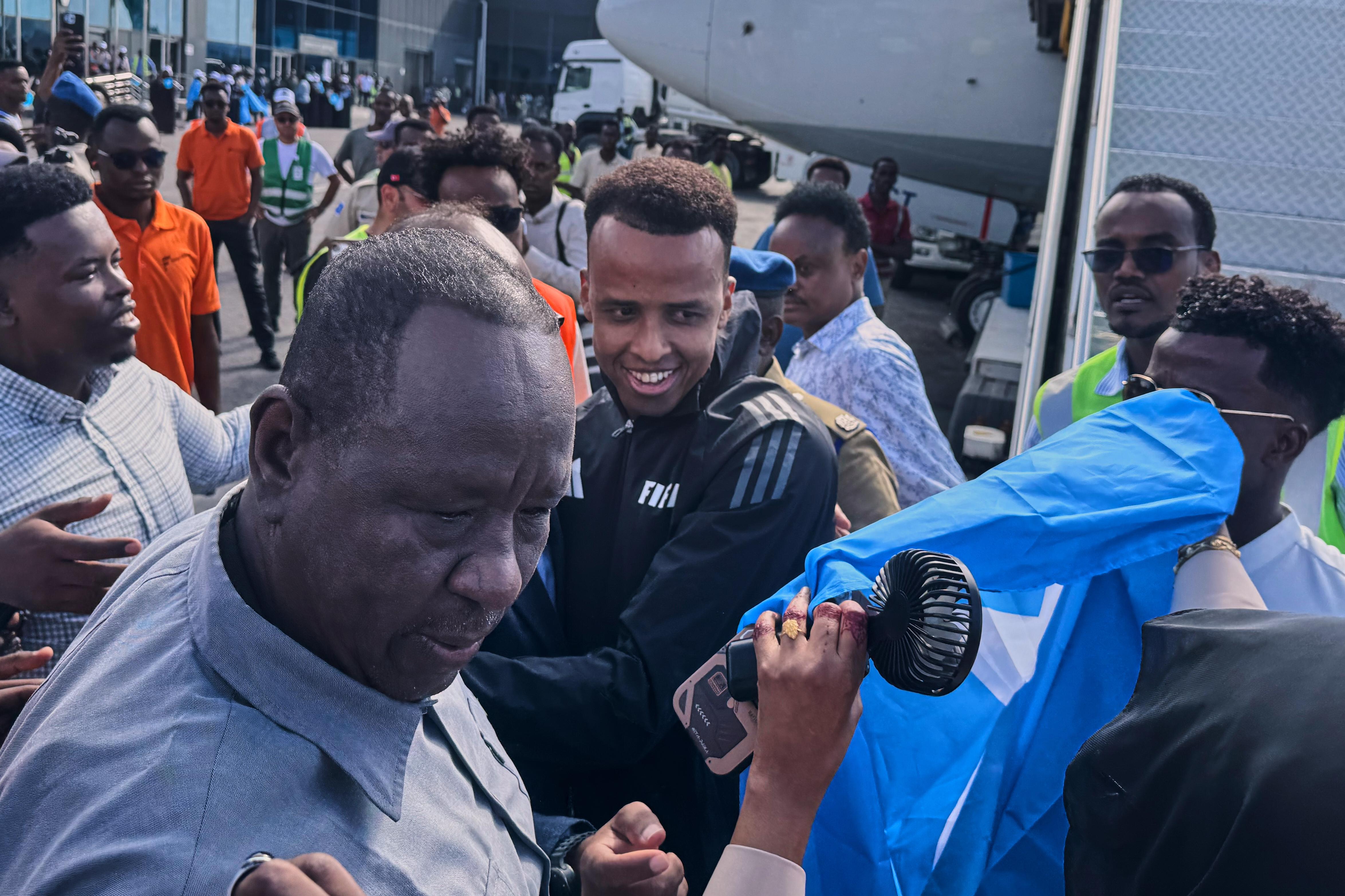Referee Omar Artan , is welcomed by supporters upon his arrival in Mogadishu, Somalia.