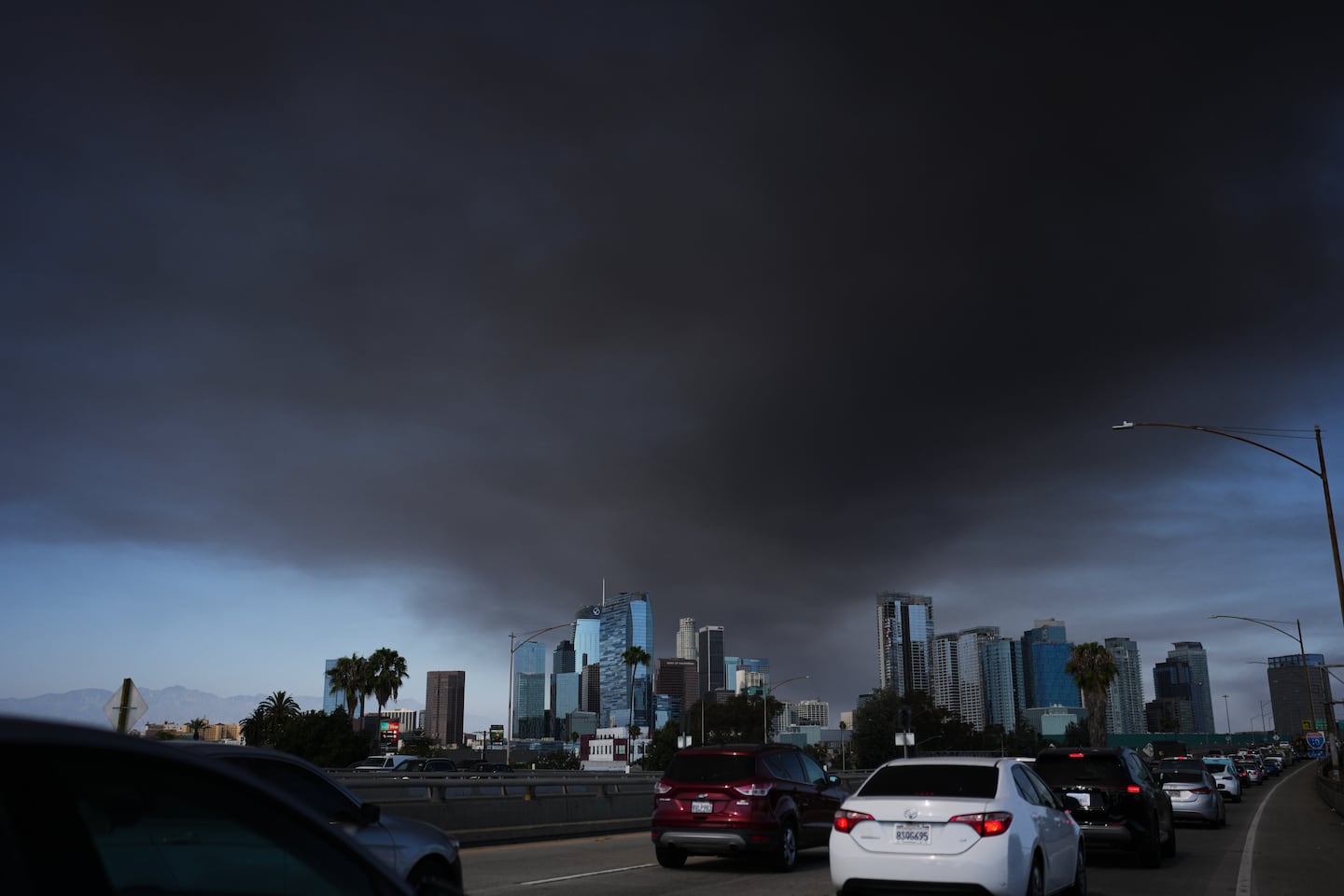 The sky is filled with smoke from a warehouse fire in Los Angeles on June 17, 2026.