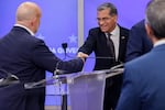 Xavier Becerra, Democratic gubernatorial candidate for California, and Steve Hilton, Republican gubernatorial candidate for California, shake hands while arriving for a gubernatorial debate at KRON Studios in San Francisco, California, US, on Wednesday, April 22, 2026.