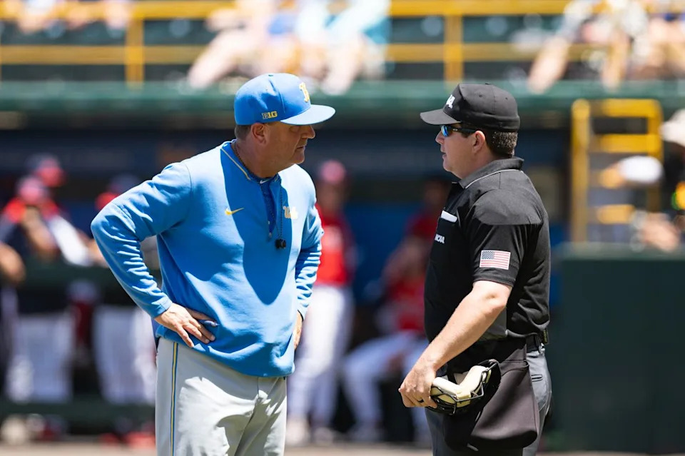 UCLA Bruins head coach John Savage talks to the umpire during an NCAA regional championship elimination game between the Saint Mary's College Gaels and UCLA Bruins on May 31, 2026 at Jackie Robinson Stadium in Los Angeles Calif.