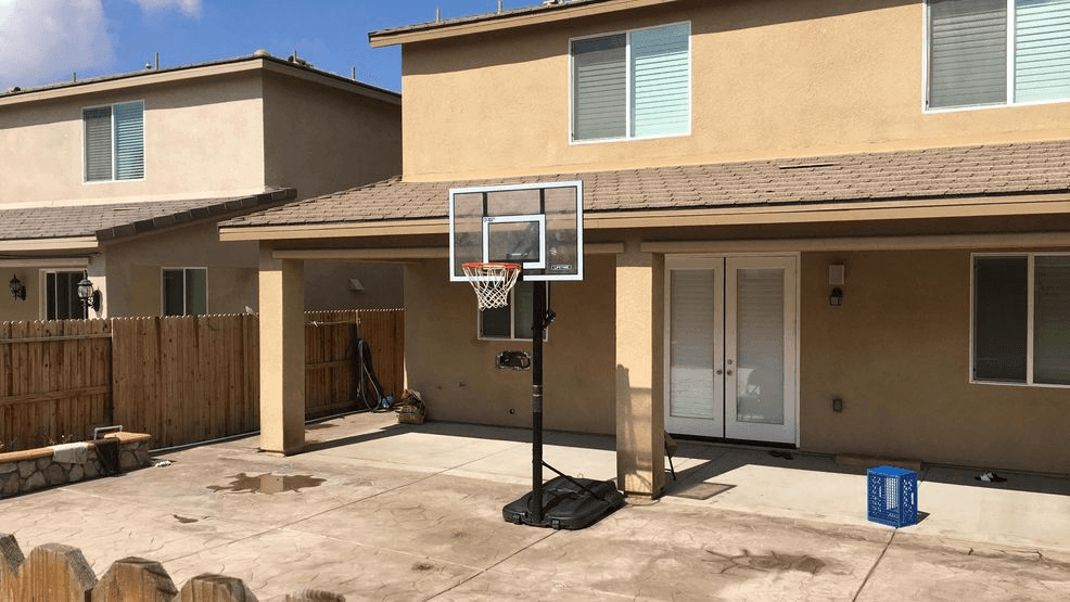 FILE: The backyard of a home in southwest Bakersfield, Calif., where police said a newborn baby was murdered and buried, is seen Thursday, Feb. 28, 2019. (KBAK/KBFX photo)