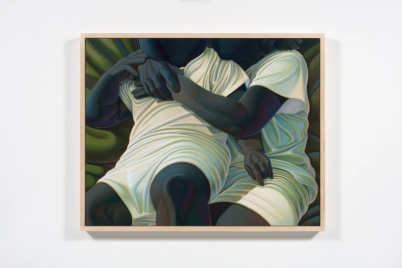 Two figures holding each other.