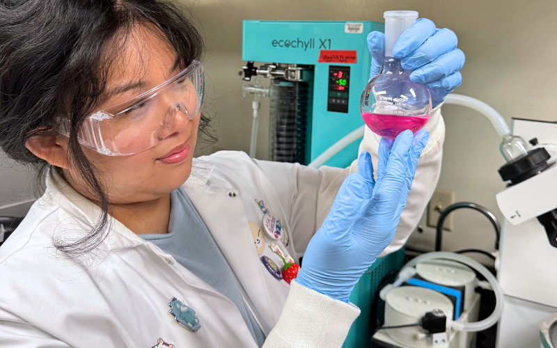 Chemistry alum Amanda Tsang conducts research in the lab.