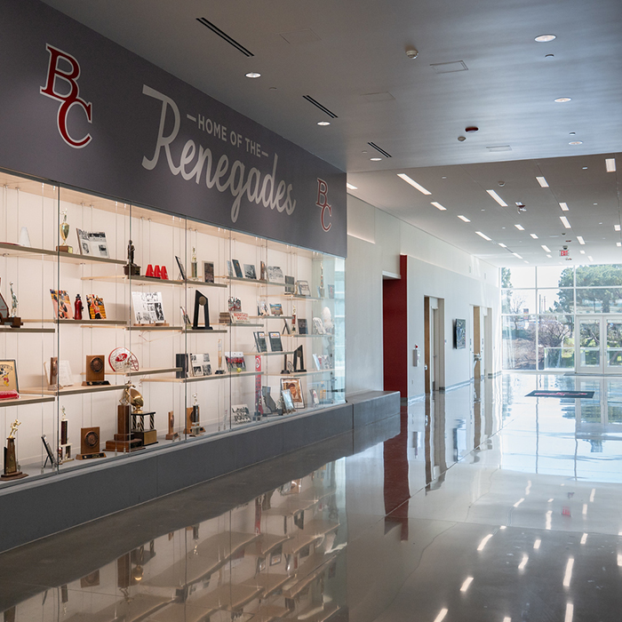 RAC lobby with historical artificats stored behind a glass structure