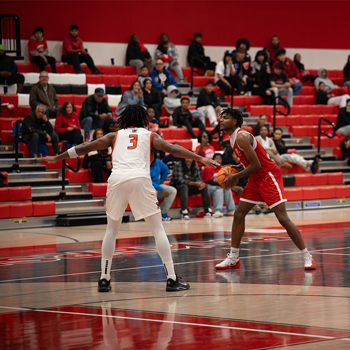 two basketball players during live competition in the gym