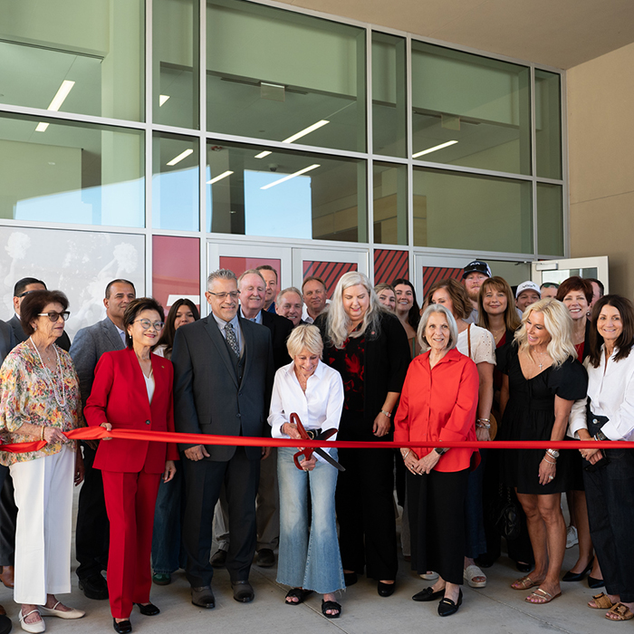 ribbon cutting ceremony in front of the Renegade Athletic Complex main entrance