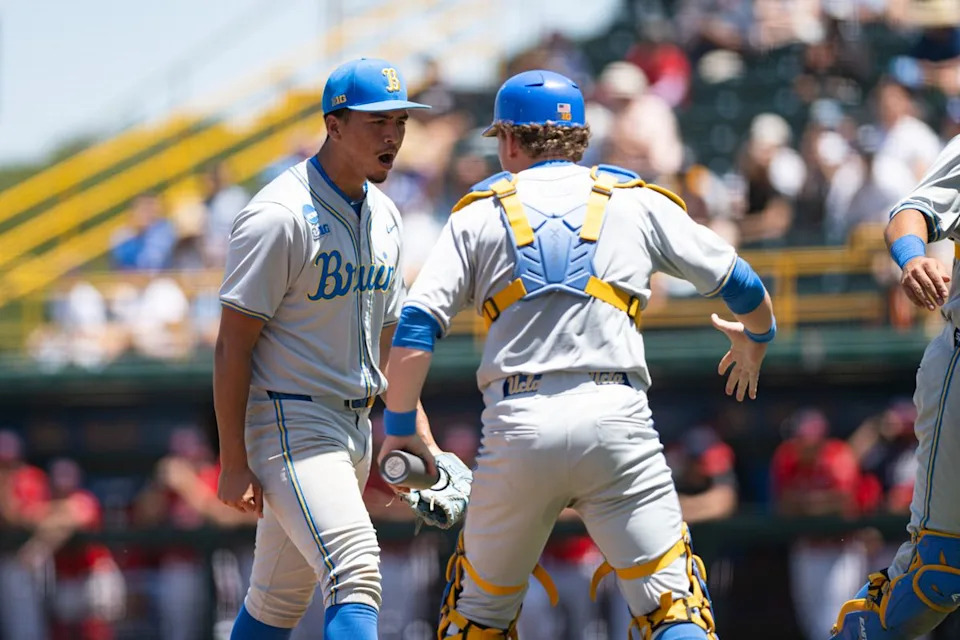 UCLA Bruins right-hand-pitcher Angel Cervantes (99) celebrates after an inning during an NCAA regional championship elimination game between the Saint Mary's College Gaels and UCLA Bruins on May 31, 2026 at Jackie Robinson Stadium in Los Angeles Calif.