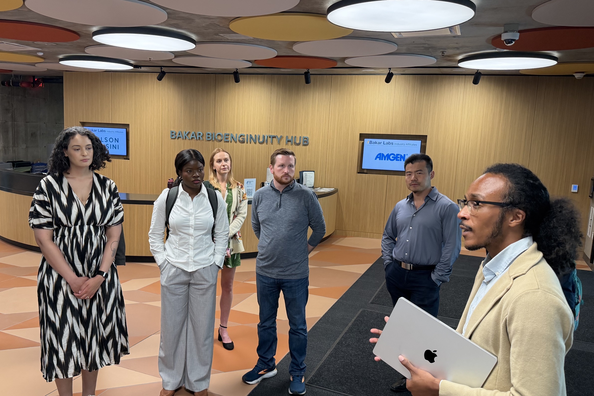 Students standing in the lobby of a building together